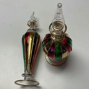 Two beautiful glass perfume bottles.